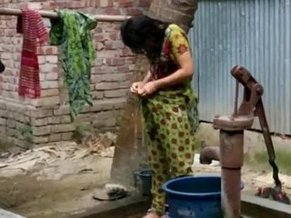 Desi girl bathes outdoors for full hd video