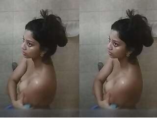 Hidden-camera footage of a sexy girl taking a bath